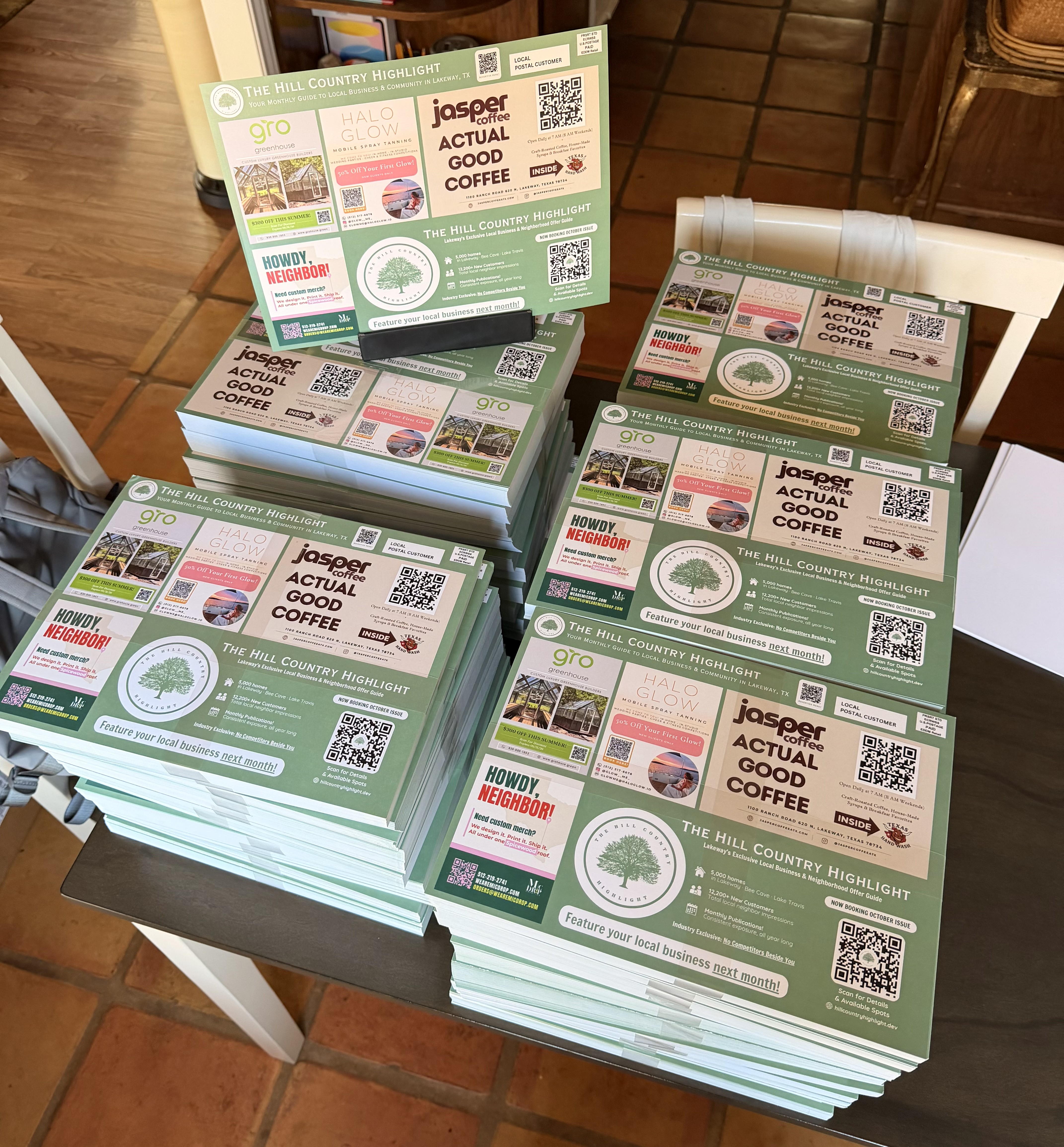 Stacks of the printed August issue mailer cards ready for delivery